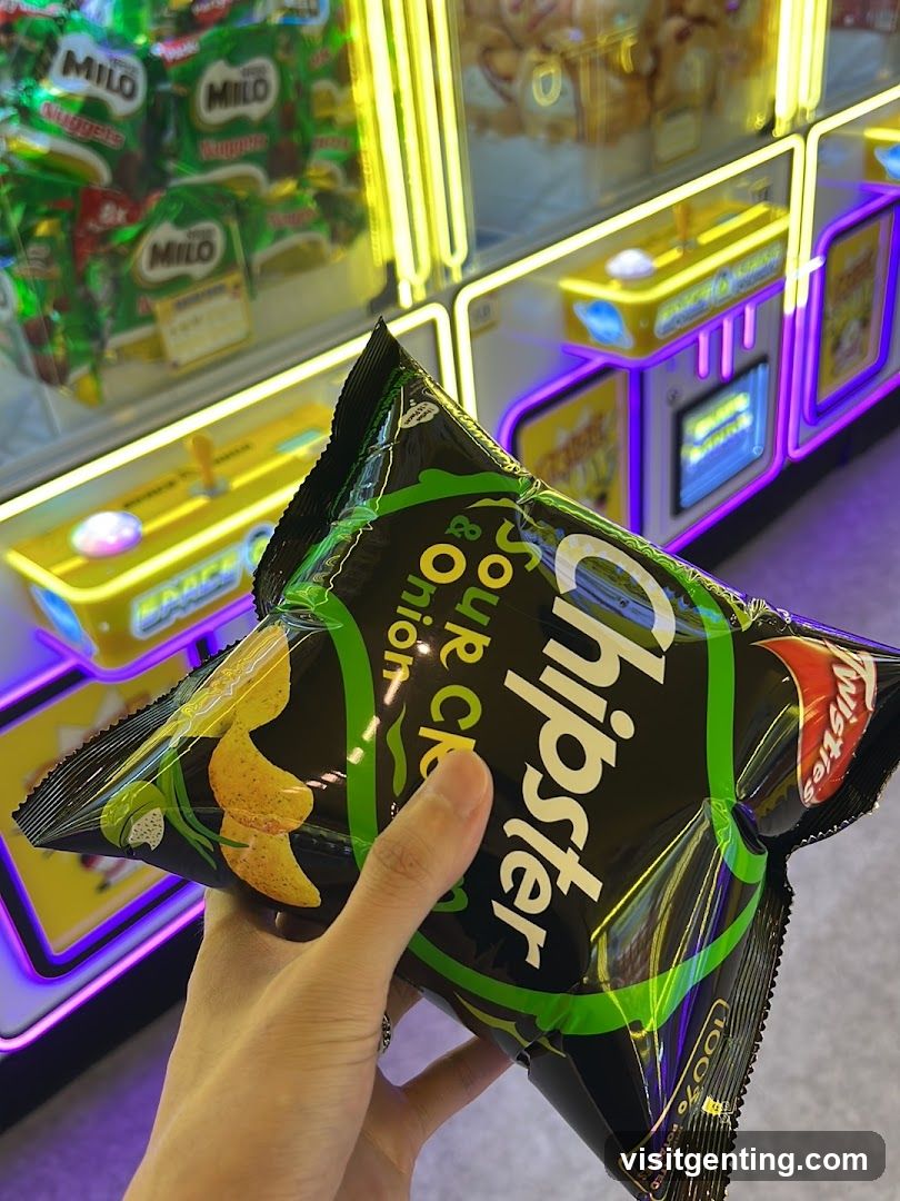 Hand holding snack bag in arcade setting