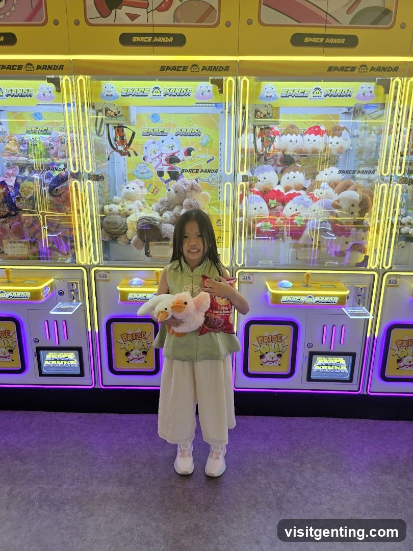 Child with plush toy in claw machine area