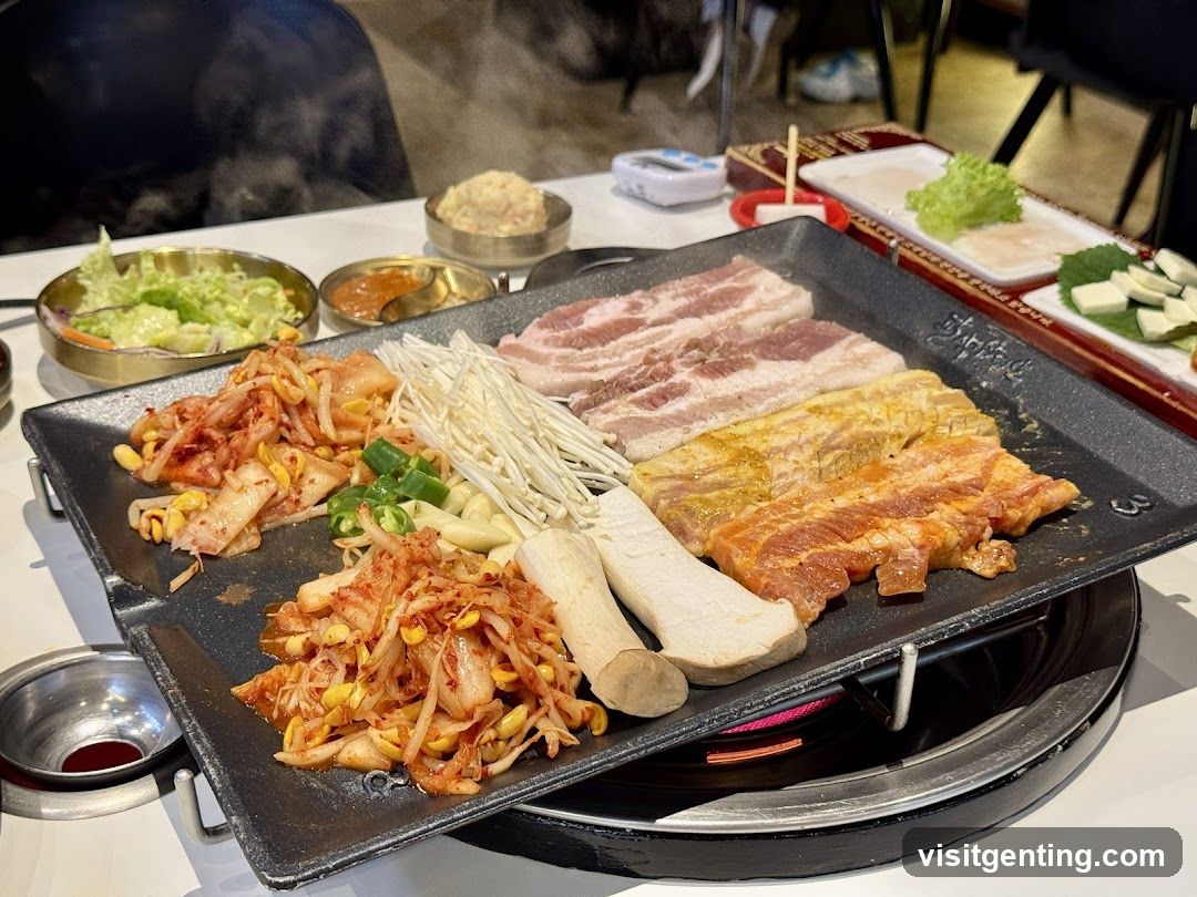 Grilled meat and side dishes on a hot plate