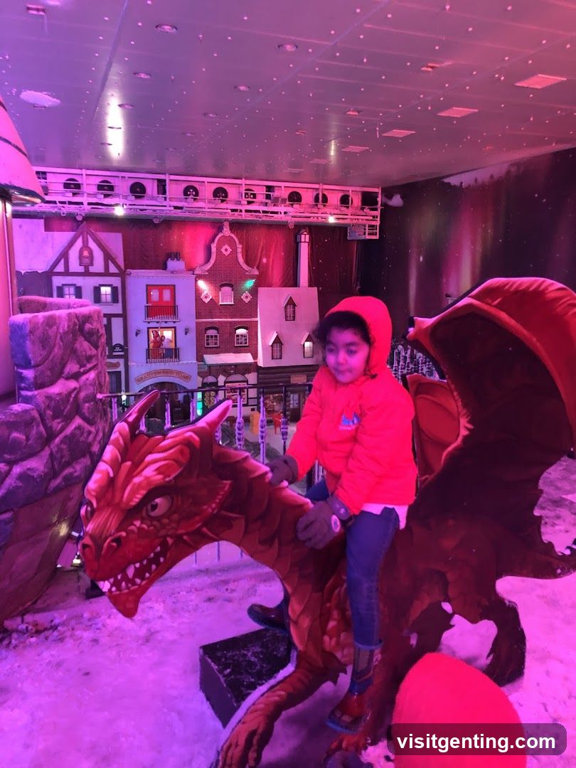 Child on dragon ride in indoor attraction