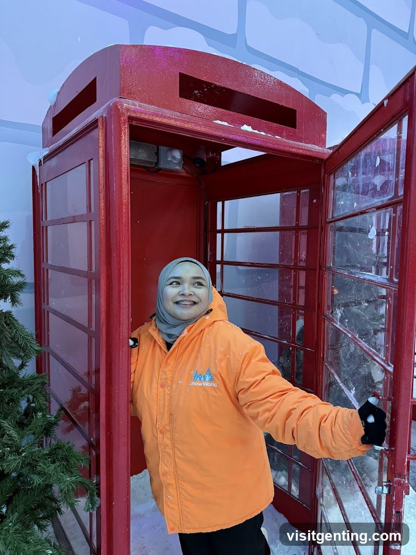 Person in Snow World Phone Booth