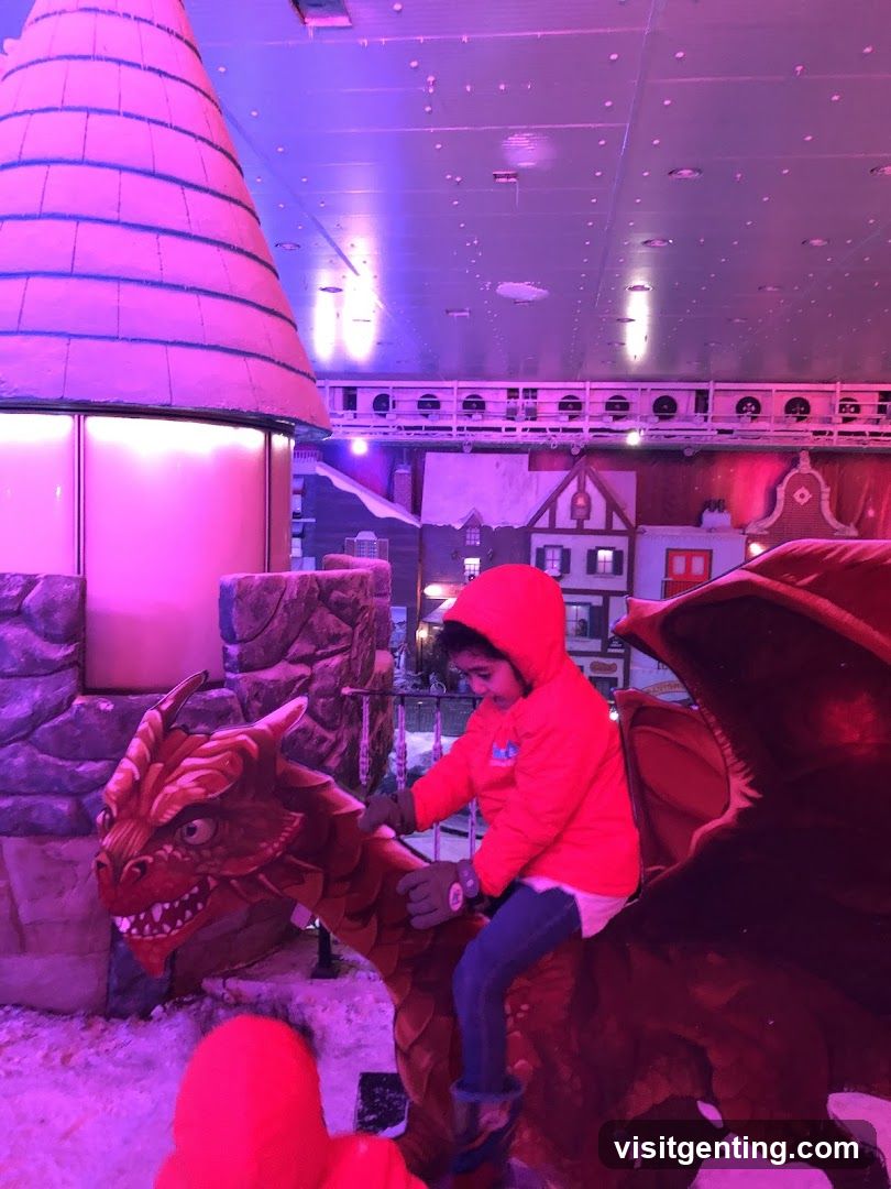 Child on dragon ride in indoor fantasy attraction
