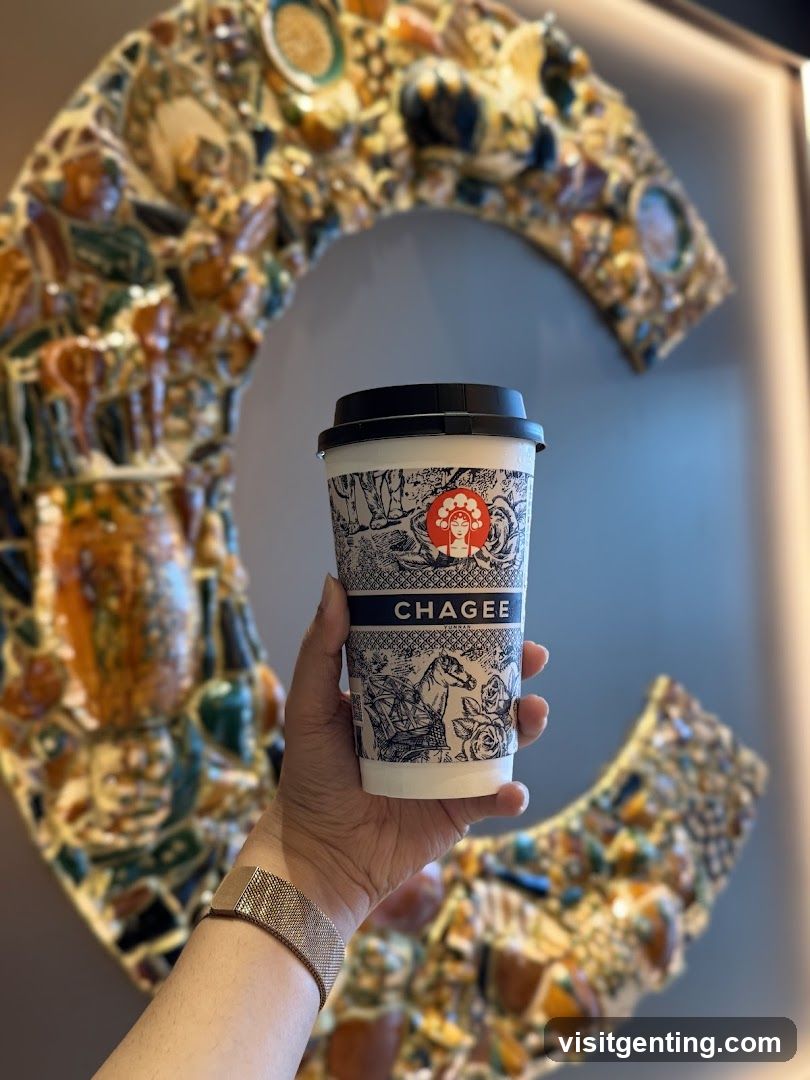 Hand holding Chagee cup