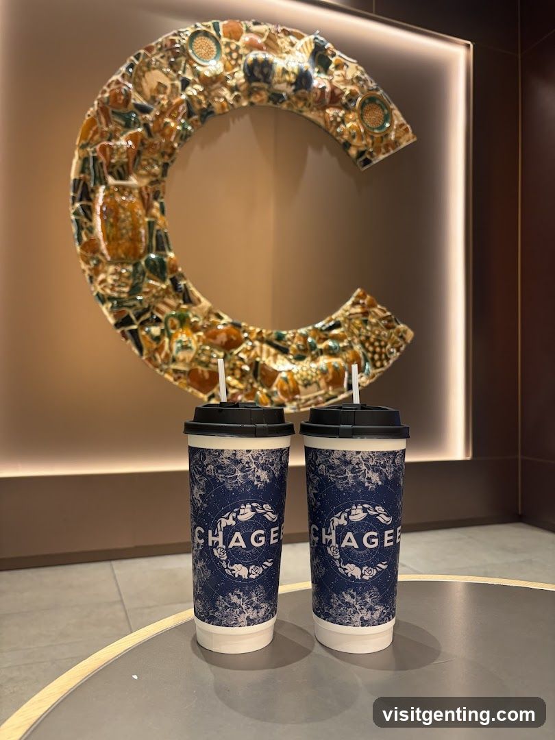 Two beverages on a table with decorative wall art