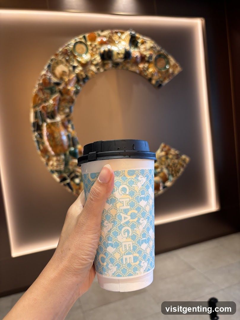 Hand holding coffee cup in interior