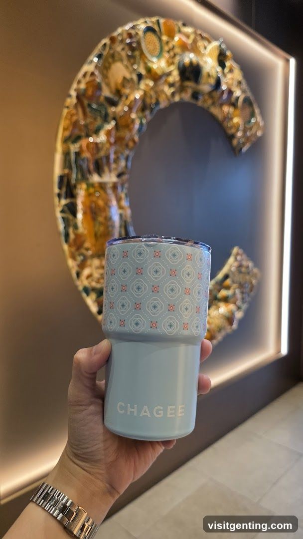 Hand holding CHAGEE branded cup