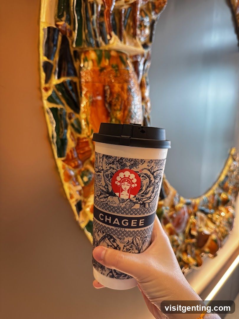 Hand holding Chagee cup