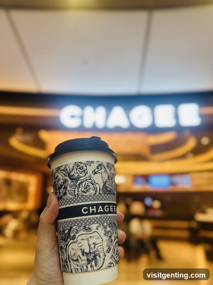 Hand holding Chagee cup in store