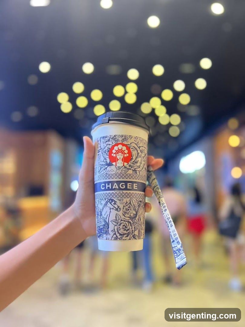 Hand holding Chagee cup