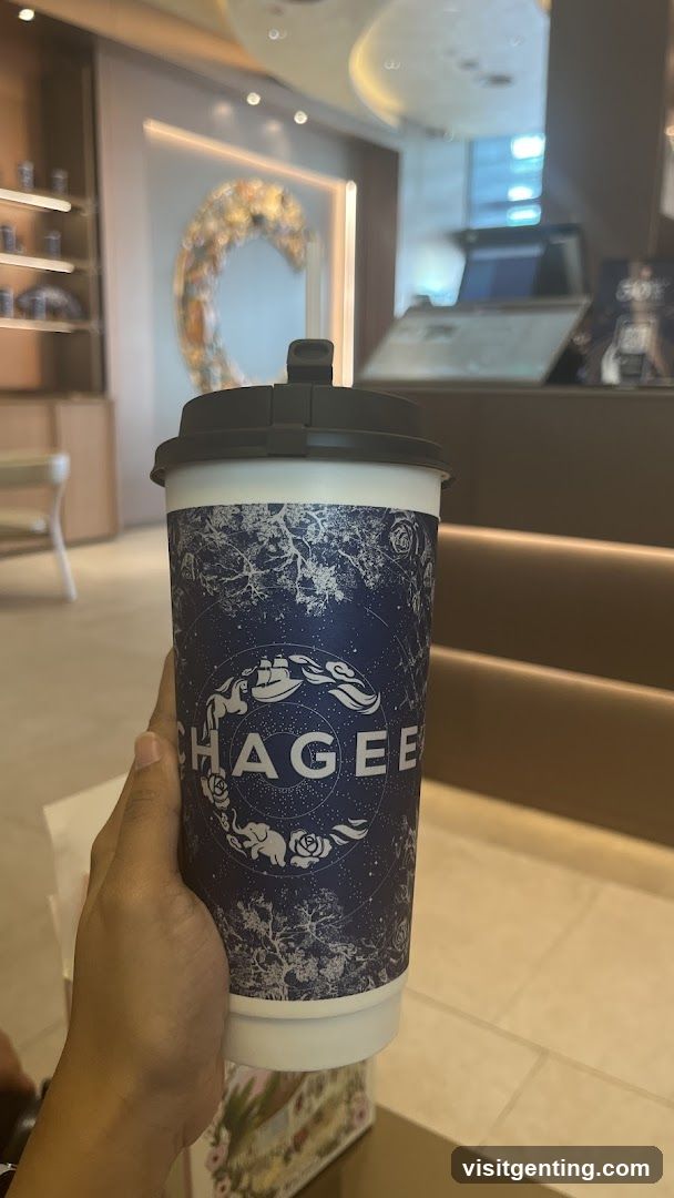 Hand holding a beverage cup