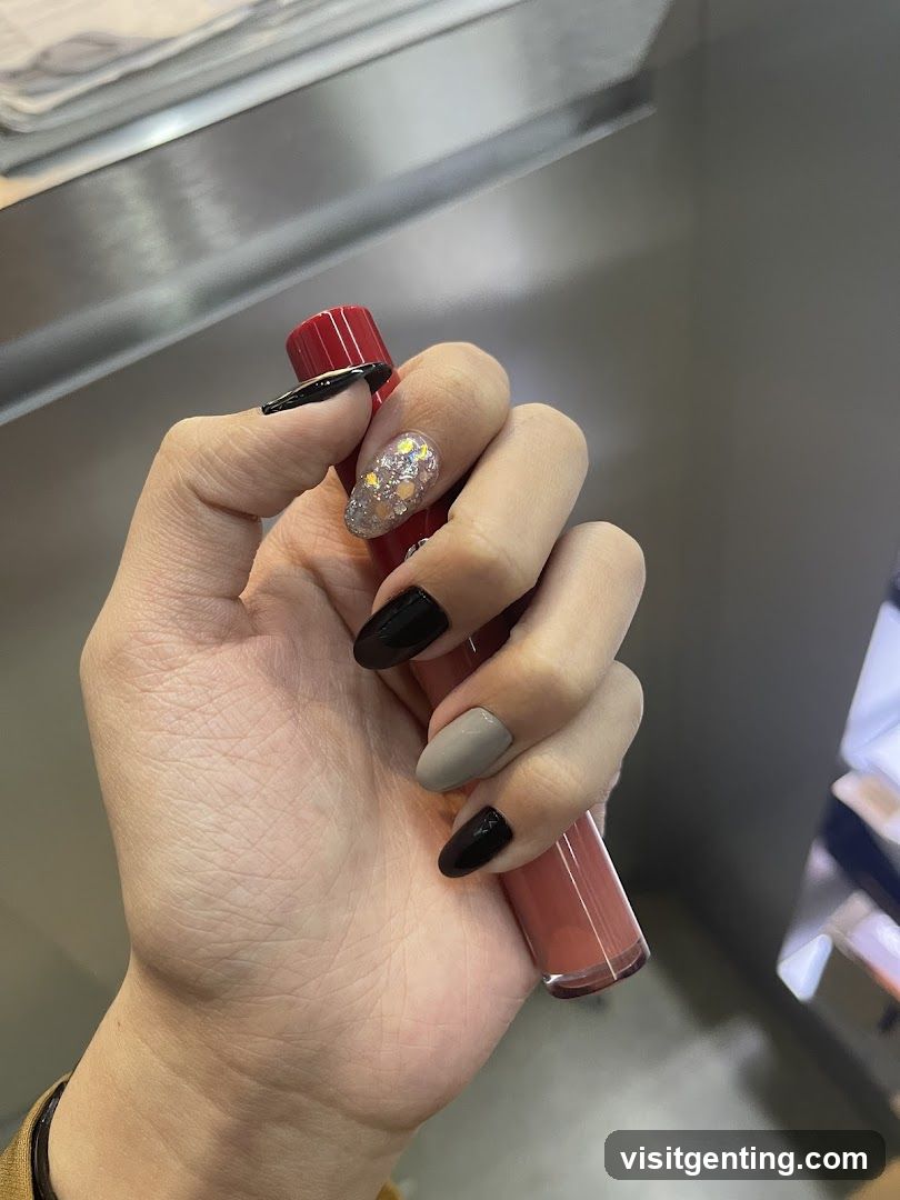 Hand holding lipstick