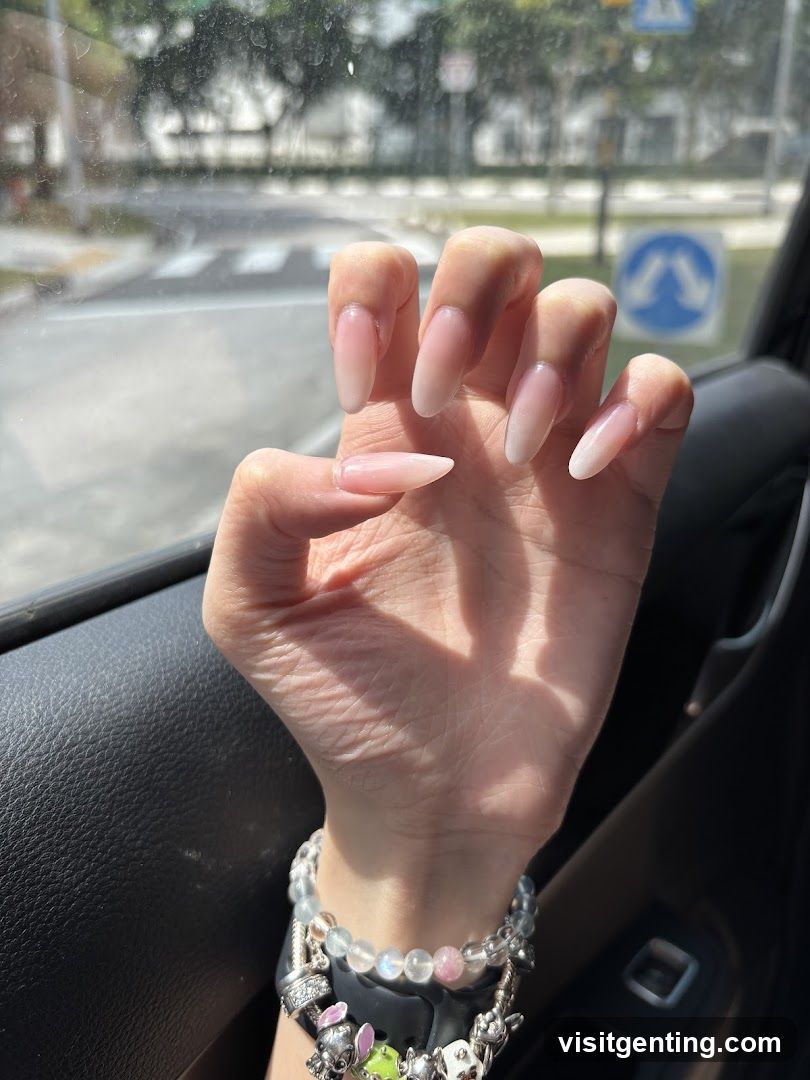 Hand with manicure inside car
