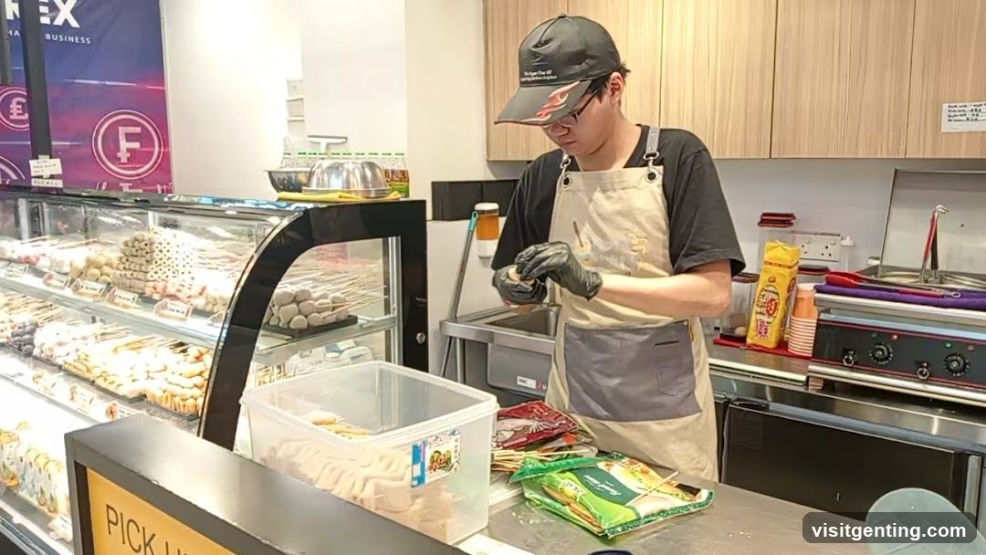 Staff preparing food in a bakery or food stall