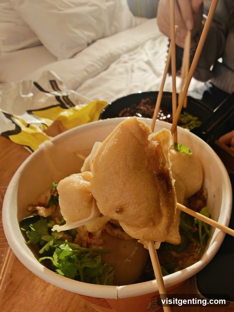 Food in a bowl with chopsticks