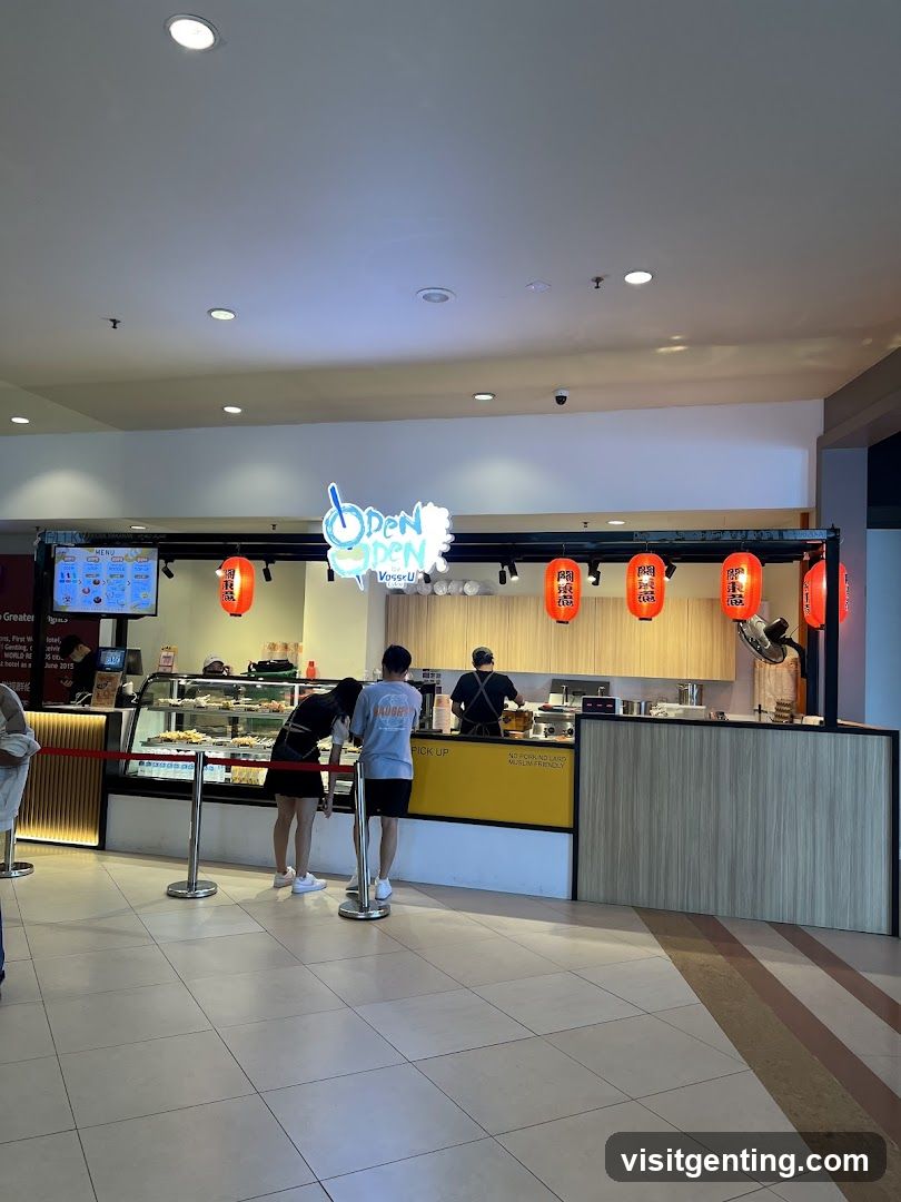 Interior food stall with customers and staff
