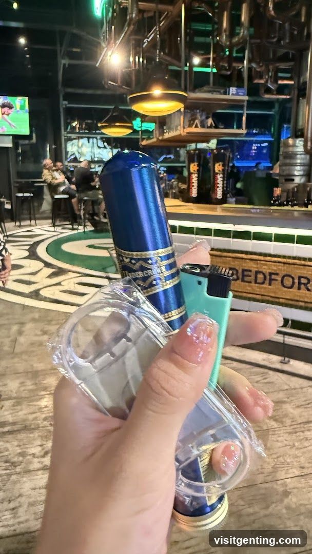 Hand holding product in bar interior