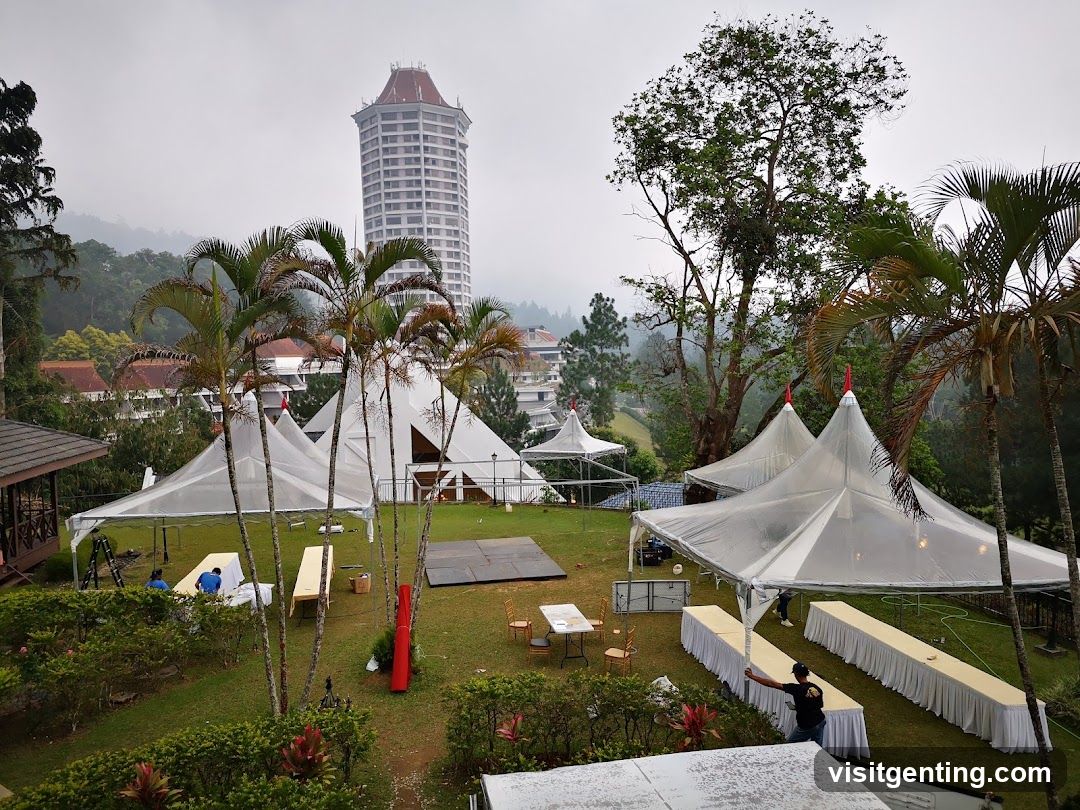 Outdoor Event Setup with Tents and Hotel Background