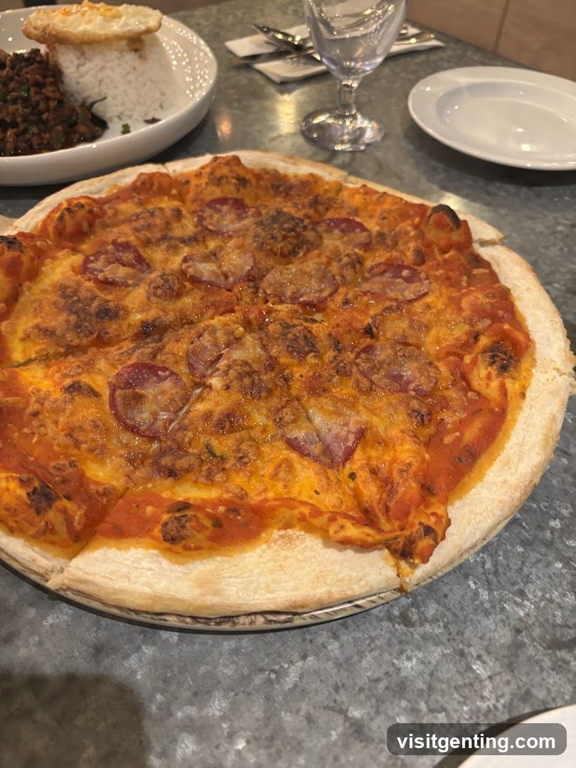 Pizza and side dish on table