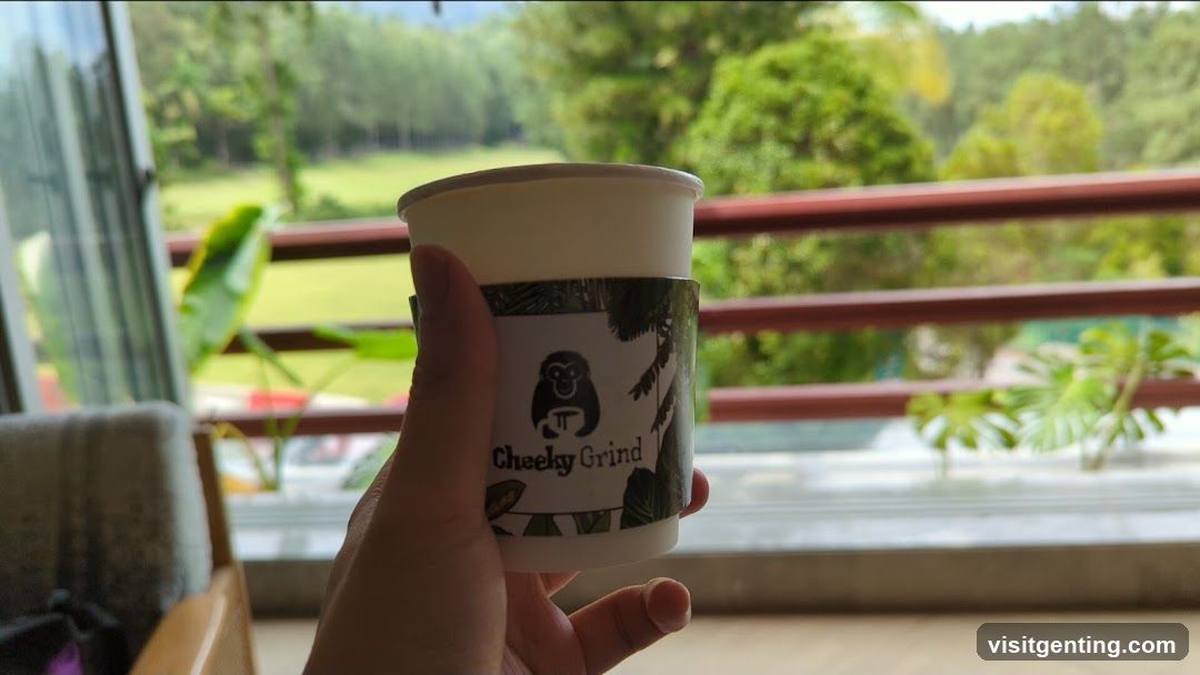 Hand holding coffee cup