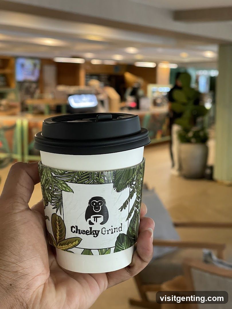 Hand holding coffee cup at cafe
