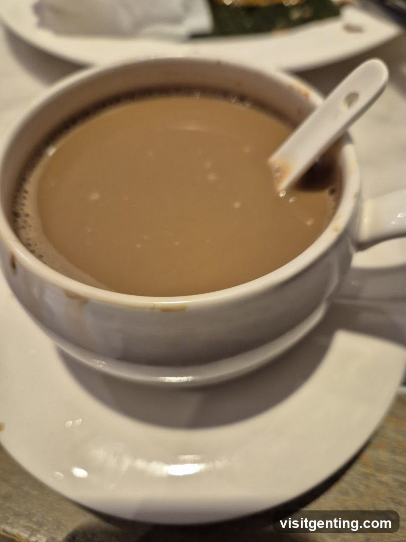 Cup of beverage with spoon