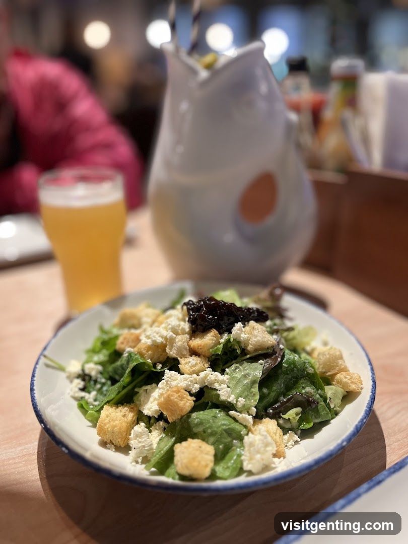 Salad and beverage at dining table