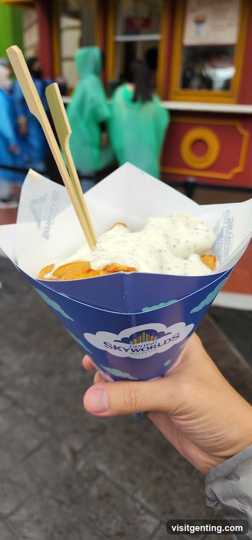 Hand holding food from Genting Skyworlds
