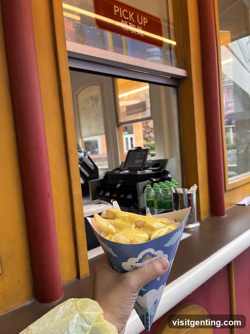 Hand holding food at pickup window