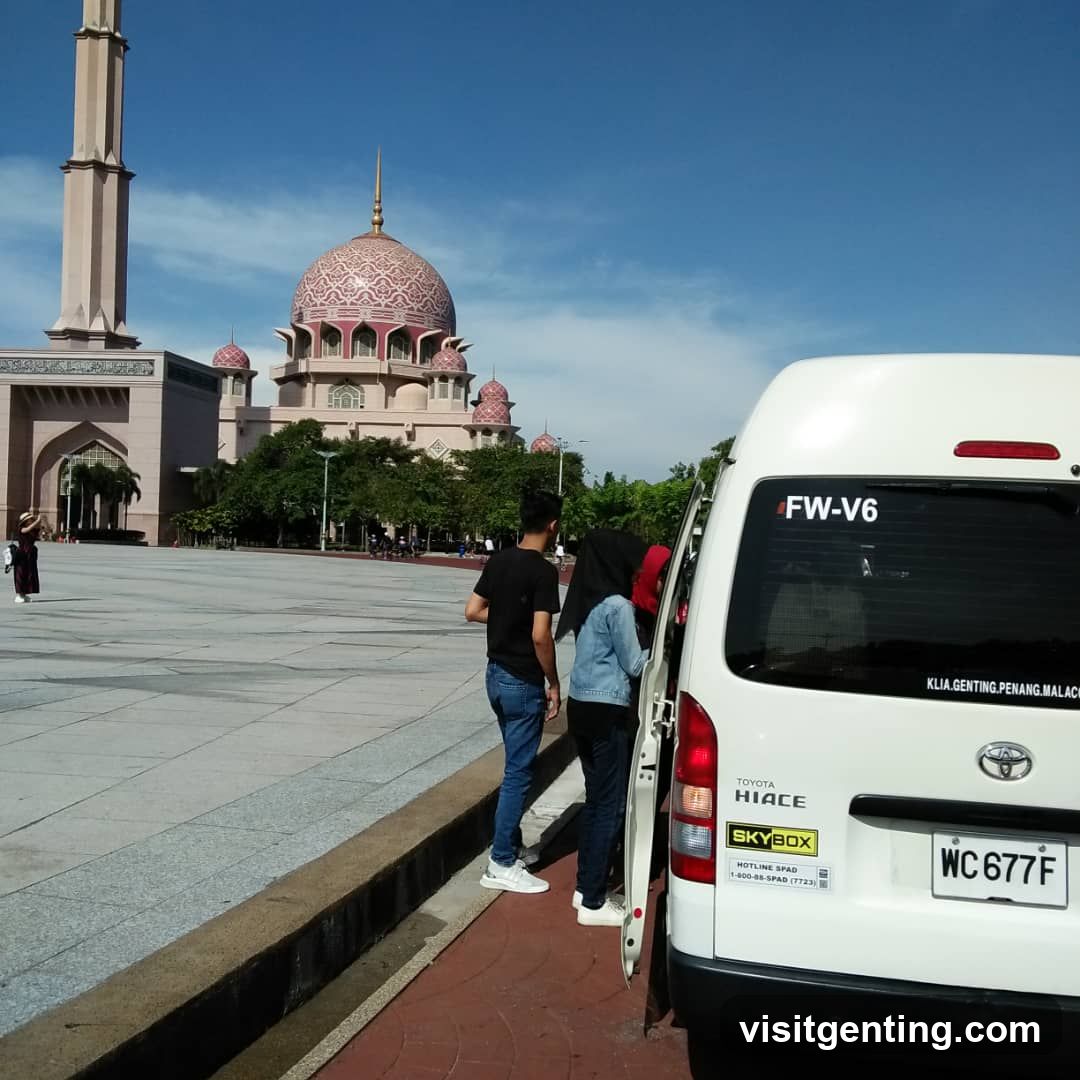 People near van at mosque complex