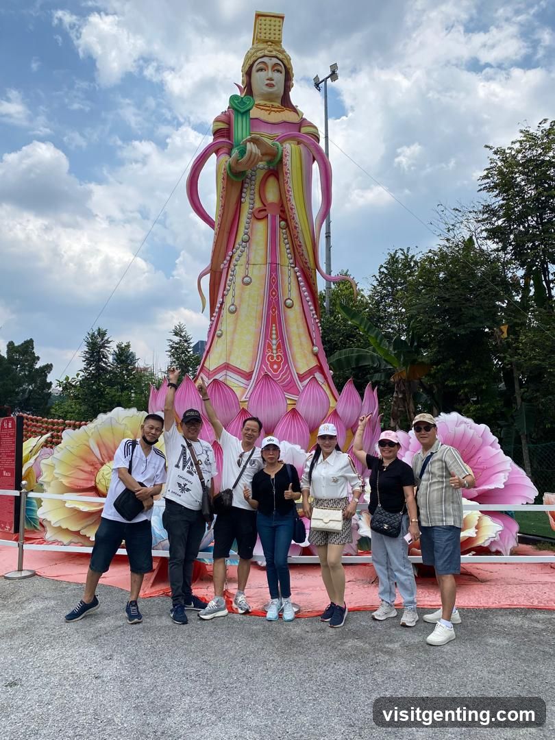 Group photo in front of a large statue