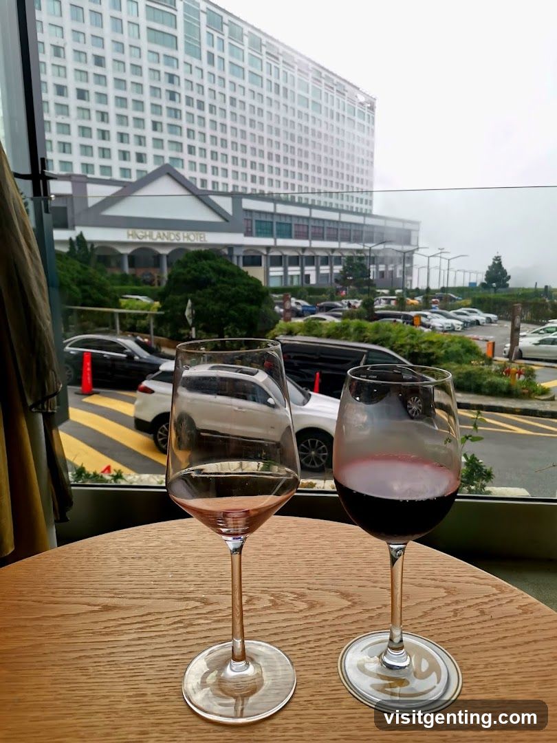Wine glasses on table with hotel view