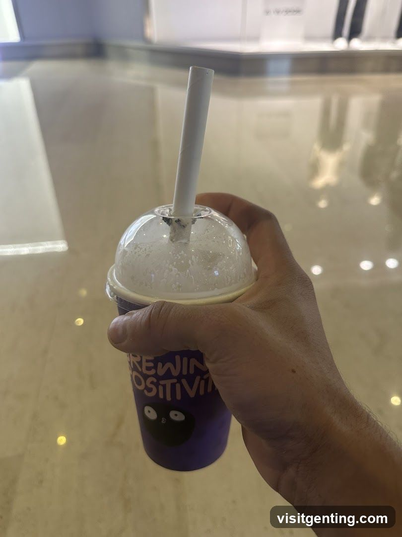 Hand holding drink cup