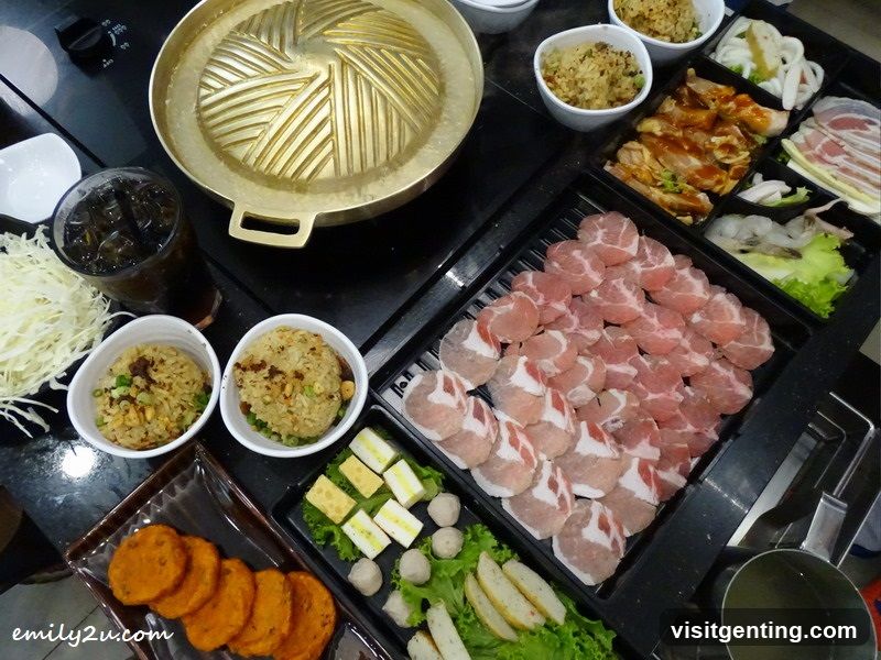 Grilled meat and side dishes spread out on table