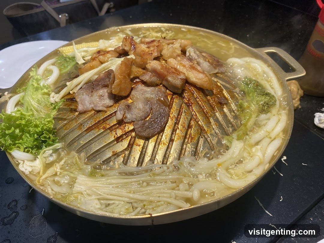 Grilled meat and vegetables on a hot pot