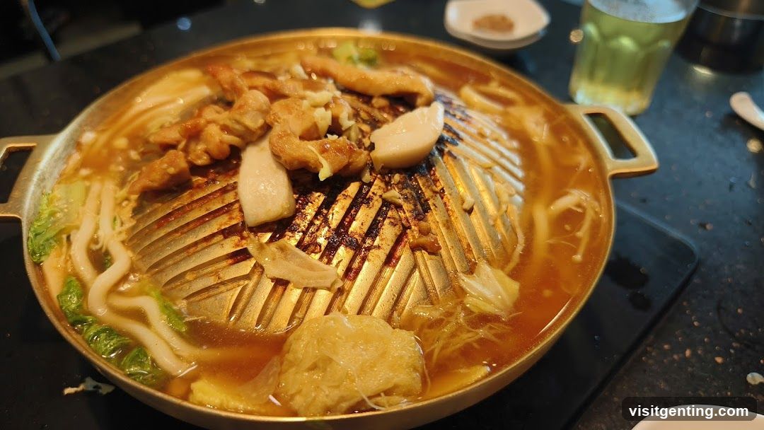 Grilled meat and vegetables on a hot plate