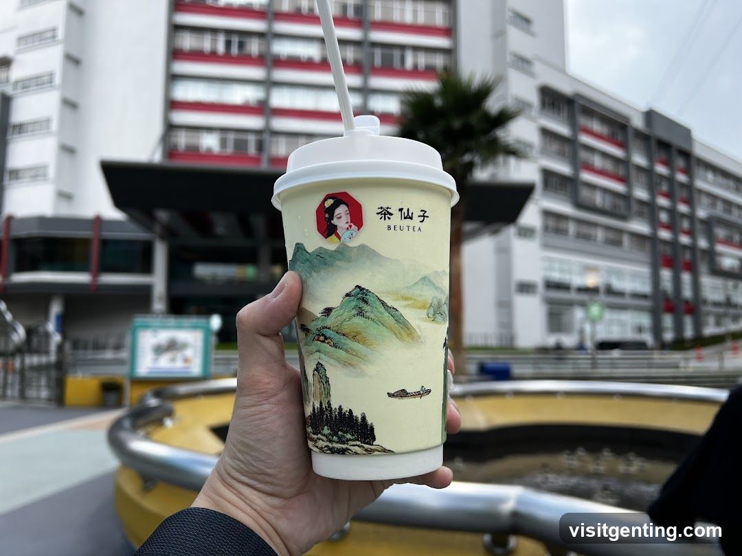 Hand holding a branded beverage cup