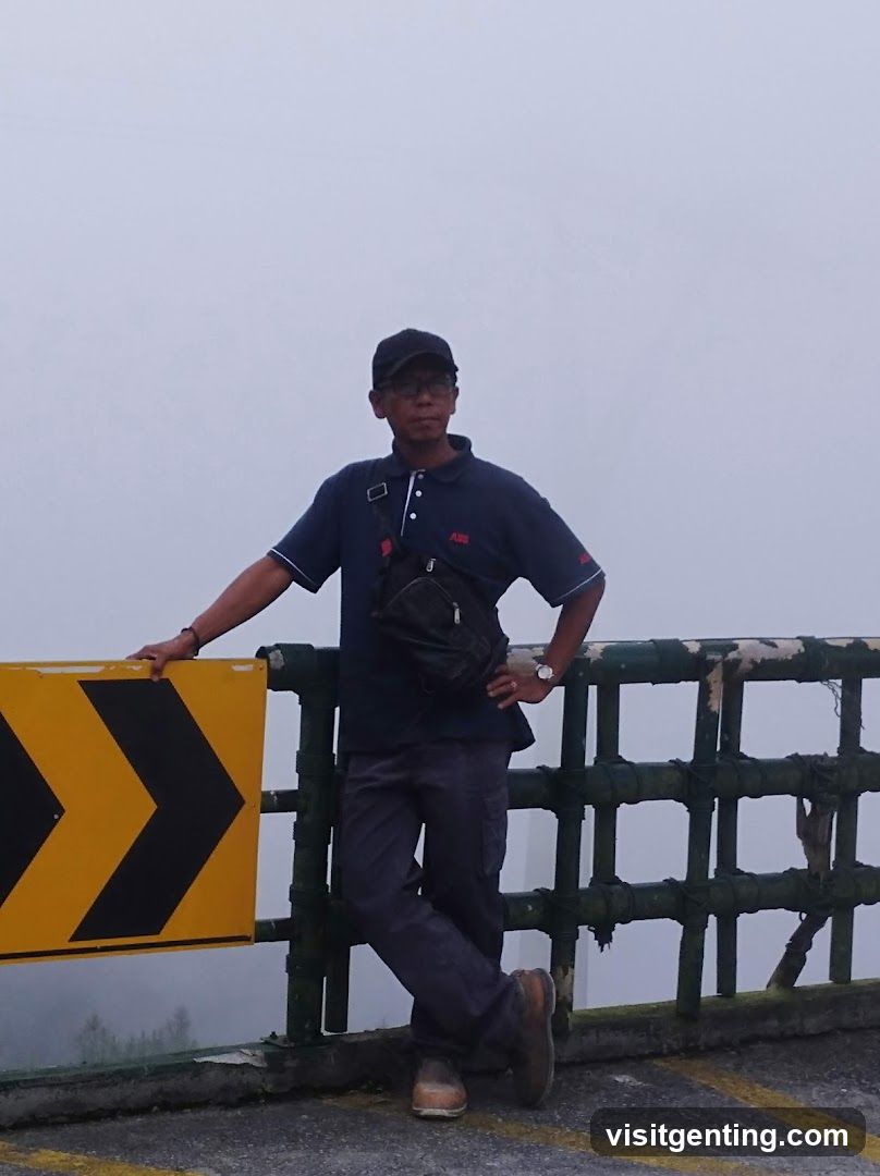 Man standing on elevated road with fog