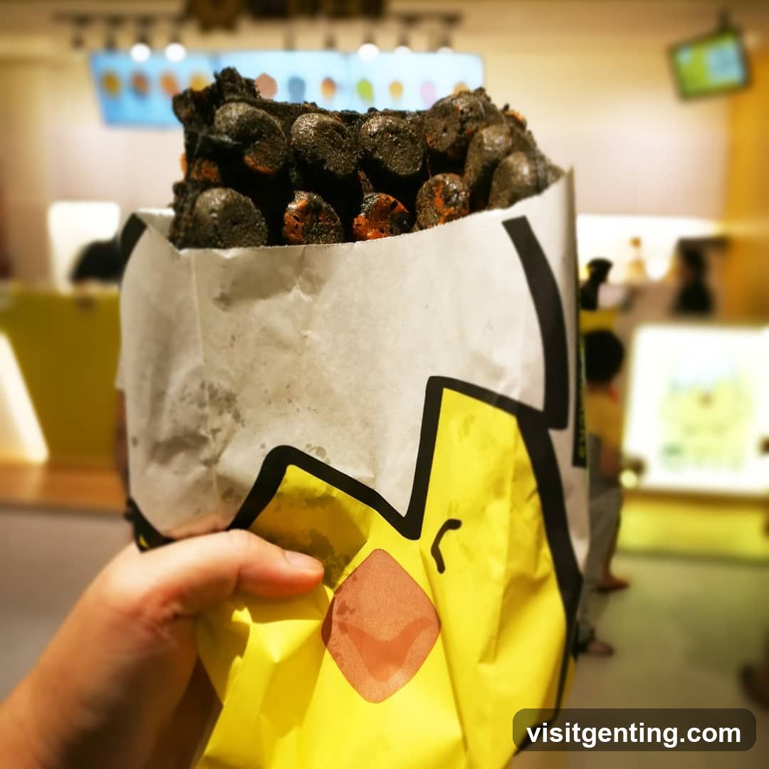 Hand holding food in branded paper bag