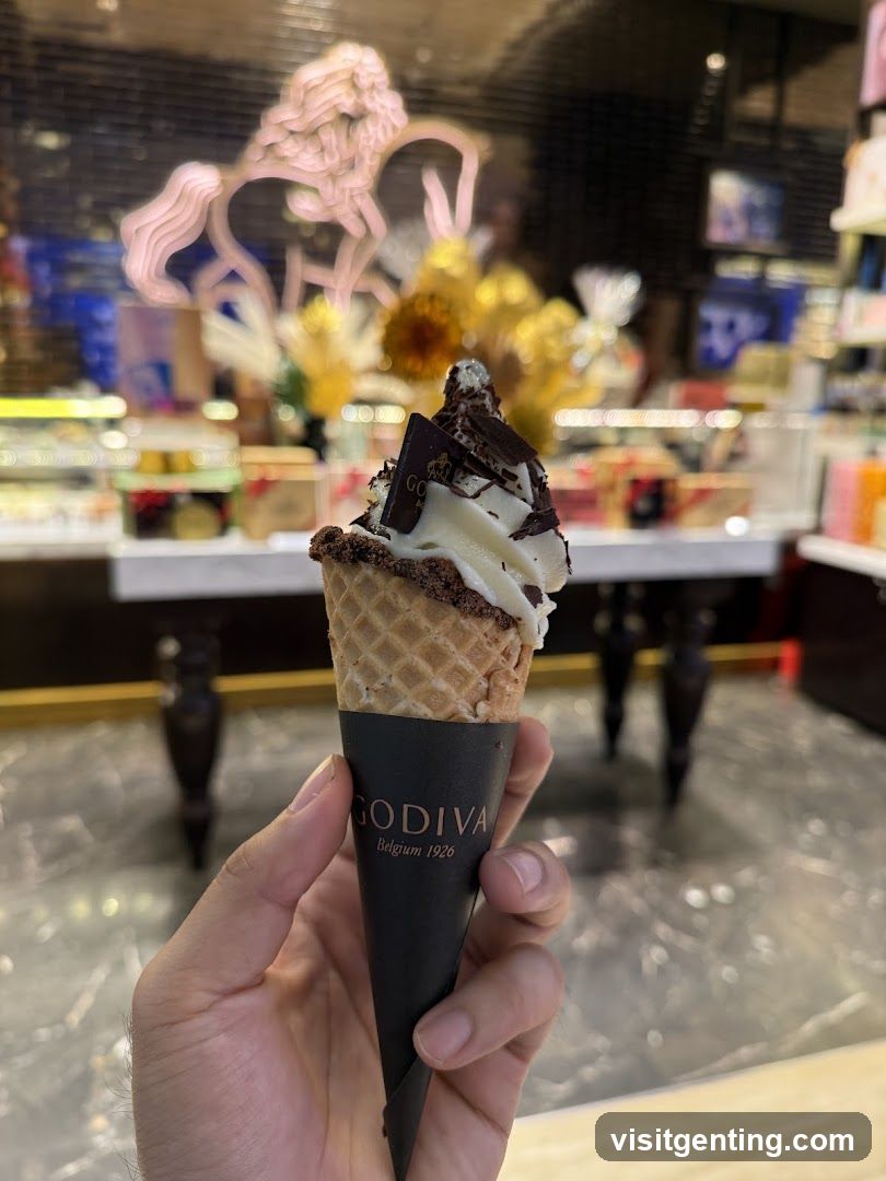Hand holding Godiva ice cream cone