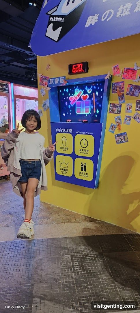 Child posing in front of interactive kiosk