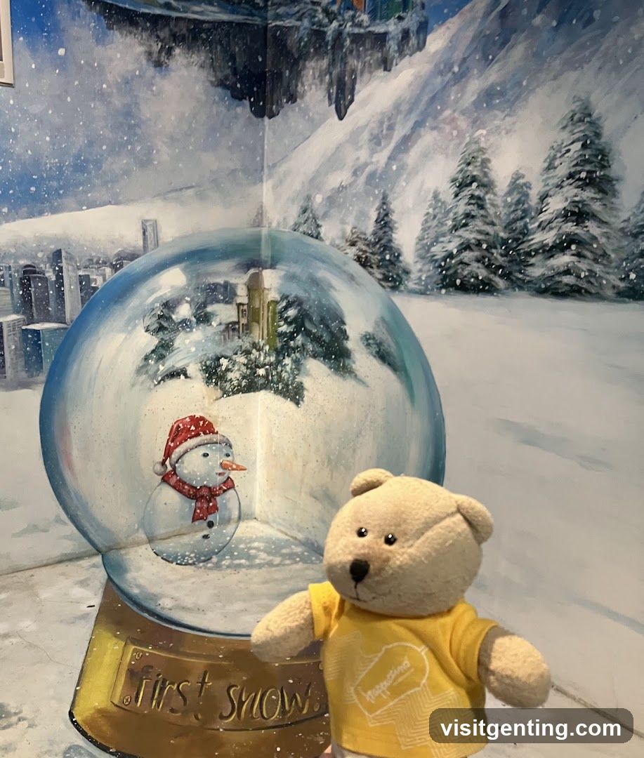 Snow globe display with teddy bear