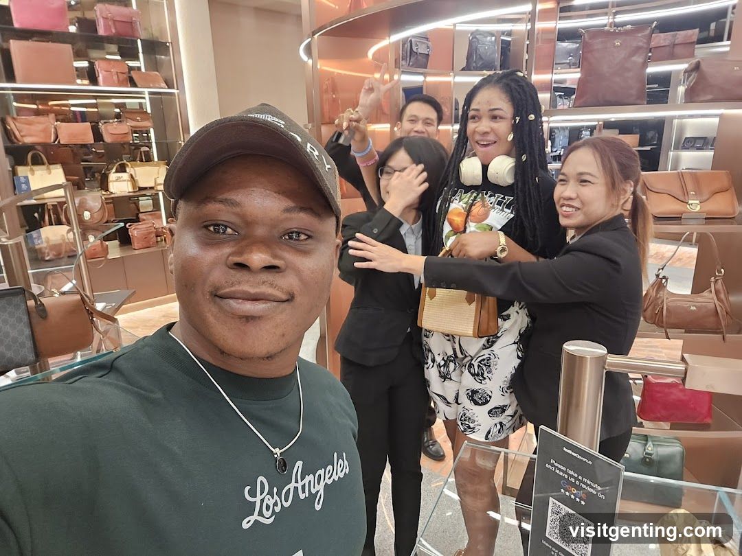 Group selfie inside a luxury goods store