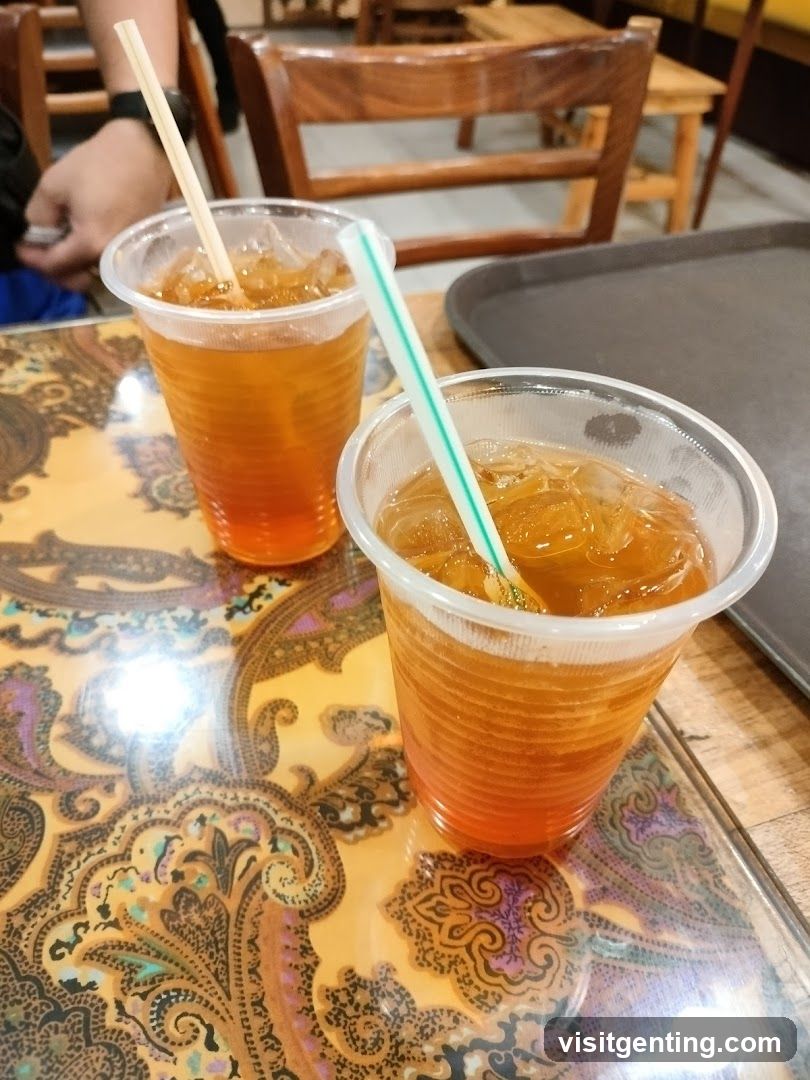 Two iced beverages on a patterned table