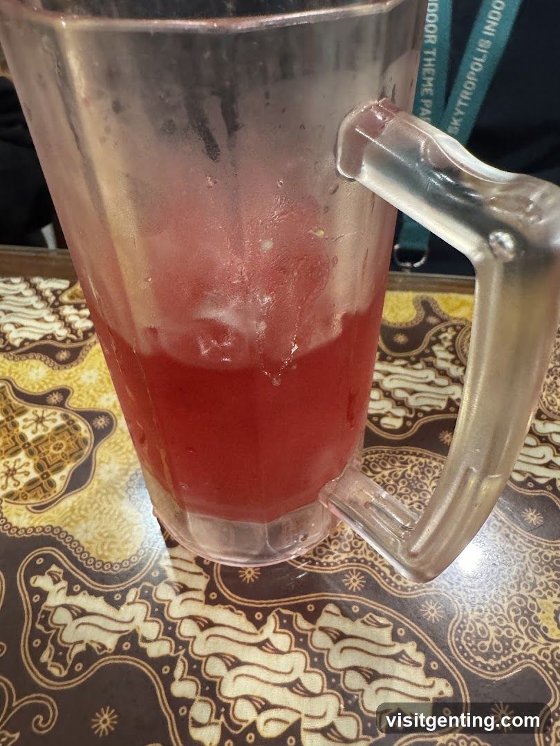 Glass of Red Beverage on Patterned Table