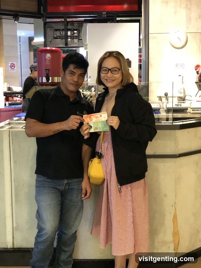 Two people posing with money inside a store
