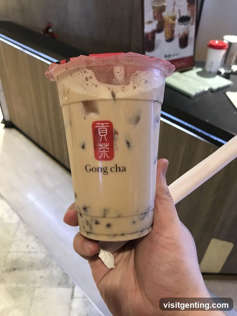 Hand holding Gong cha drink