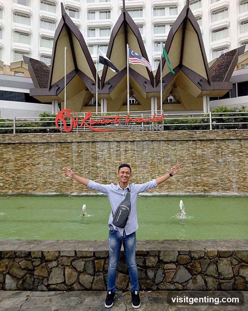 Man posing in front of Genting Resort World entrance
