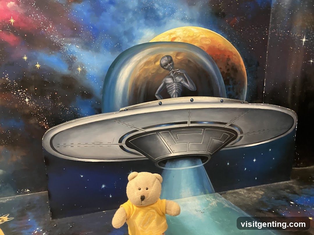 Alien-themed 3D mural with teddy bear