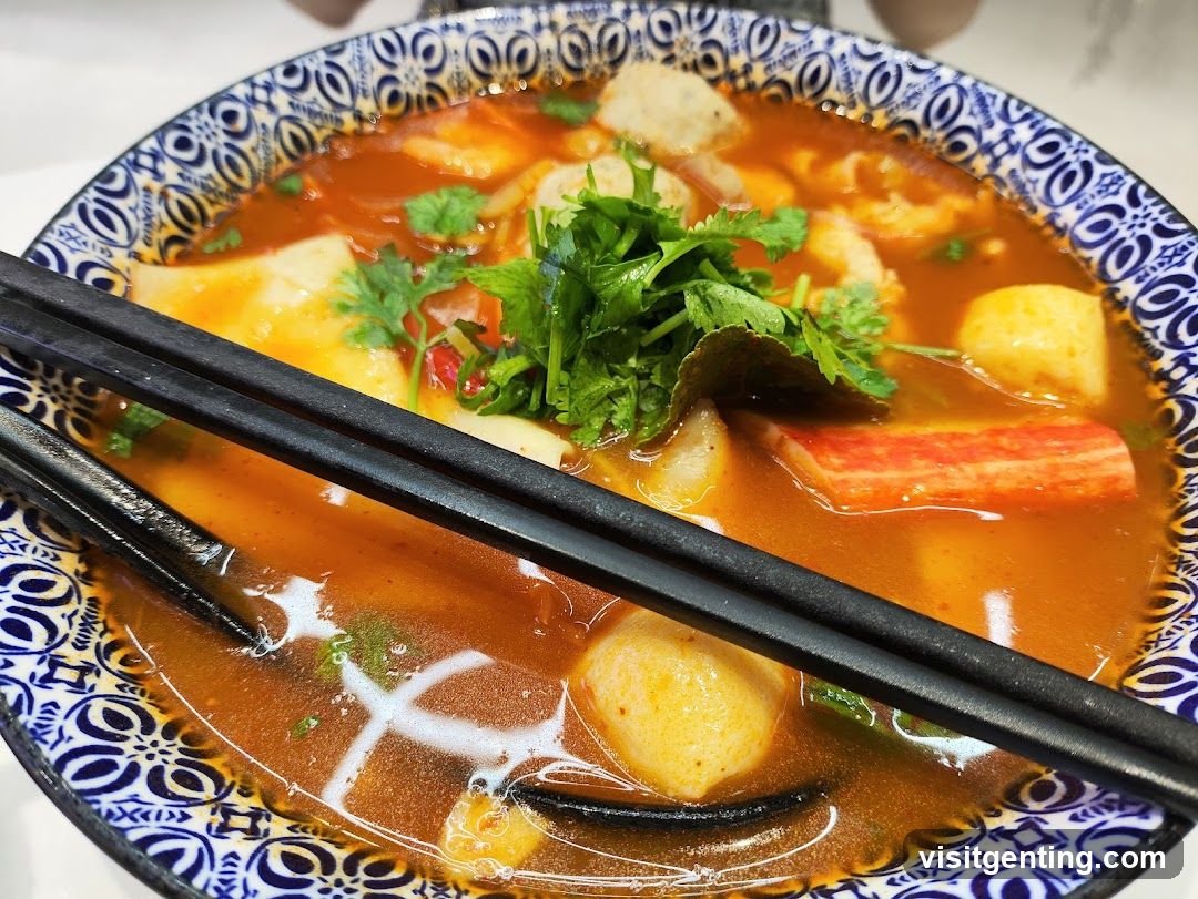 Soup in decorative bowl with chopsticks