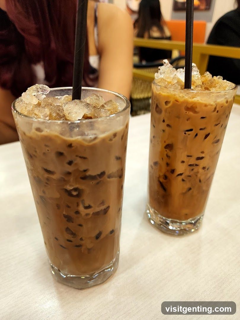 Two iced coffee drinks on a table